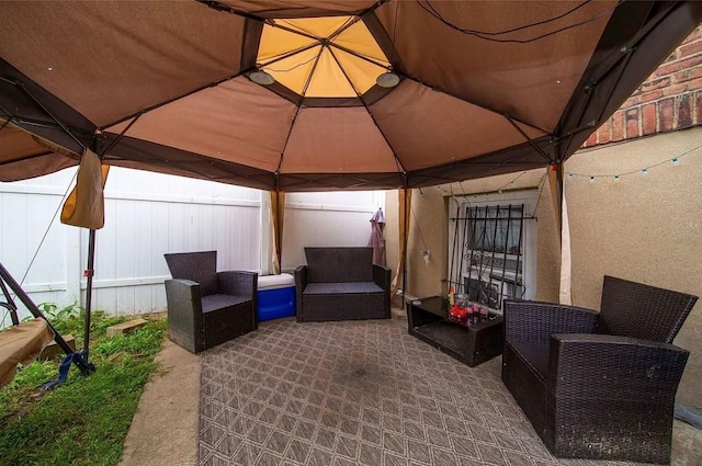 view of patio featuring a gazebo and outdoor lounge area