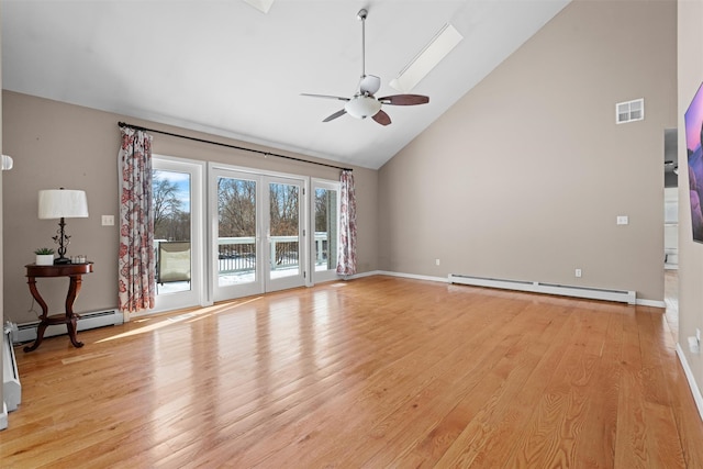 unfurnished living room featuring high vaulted ceiling, light wood-style flooring, a baseboard heating unit, and ceiling fan