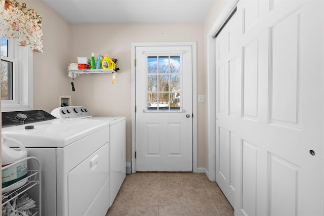 washroom with laundry area, independent washer and dryer, and light tile patterned floors