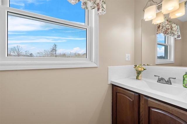 bathroom with vanity and decorative backsplash