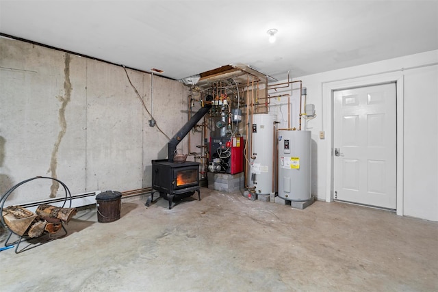 unfinished basement with a baseboard radiator, electric water heater, water heater, a heating unit, and a wood stove