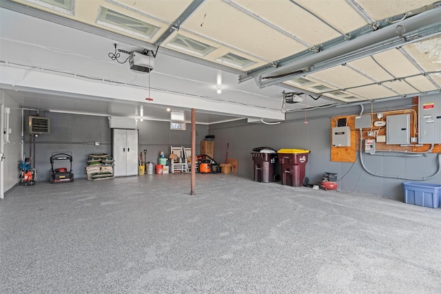 garage with electric panel and a garage door opener