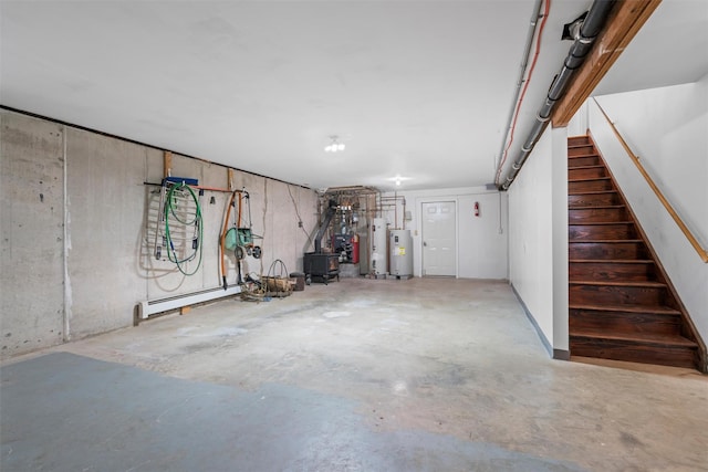 garage with water heater and baseboard heating