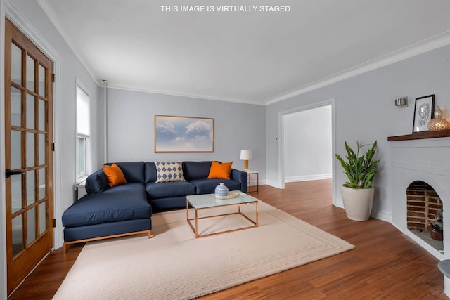 living room featuring ornamental molding, a brick fireplace, dark wood finished floors, and baseboards