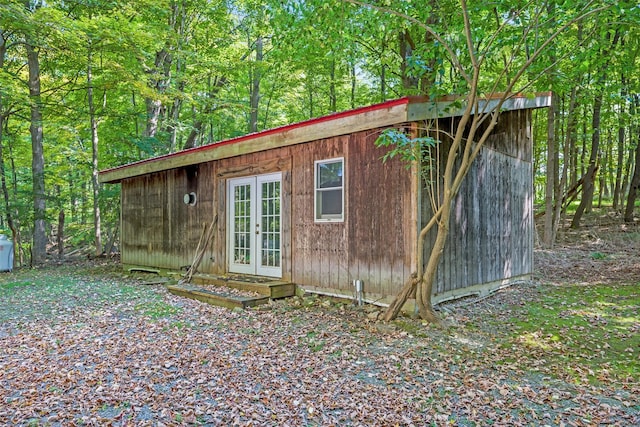 view of outdoor structure with french doors and an outdoor structure