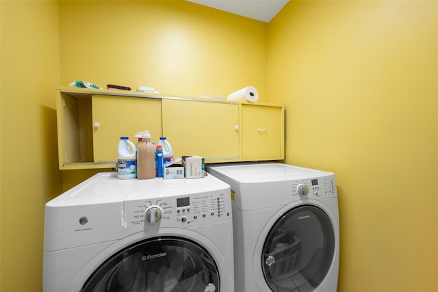 laundry room featuring laundry area and washing machine and dryer