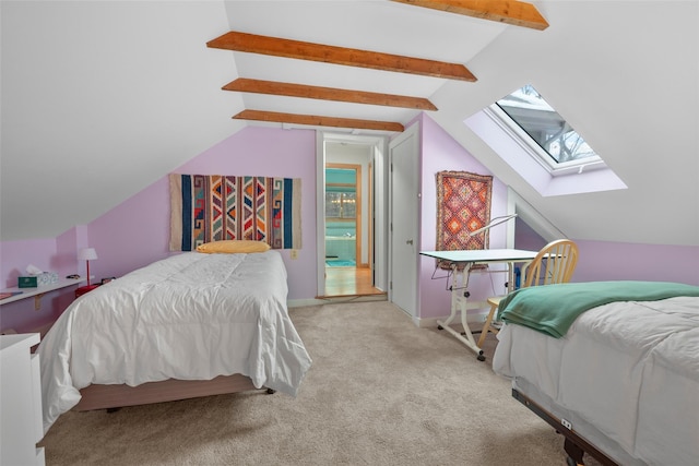 bedroom featuring carpet floors and vaulted ceiling with skylight