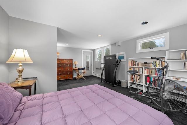 bedroom with dark carpet and recessed lighting