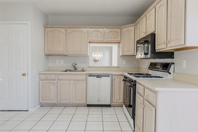 kitchen featuring a sink, light brown cabinetry, dishwasher, and range with gas cooktop