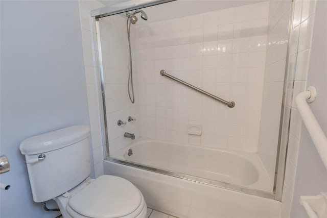 full bathroom featuring toilet and shower / bath combination with glass door