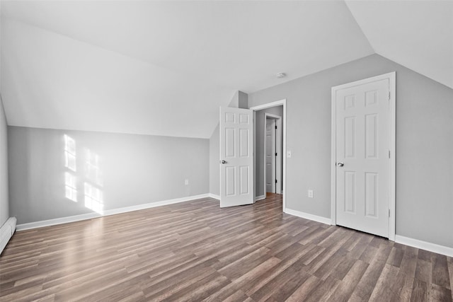 bonus room featuring lofted ceiling and hardwood / wood-style floors