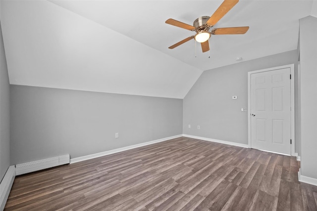 bonus room with ceiling fan, lofted ceiling, a baseboard radiator, and hardwood / wood-style floors