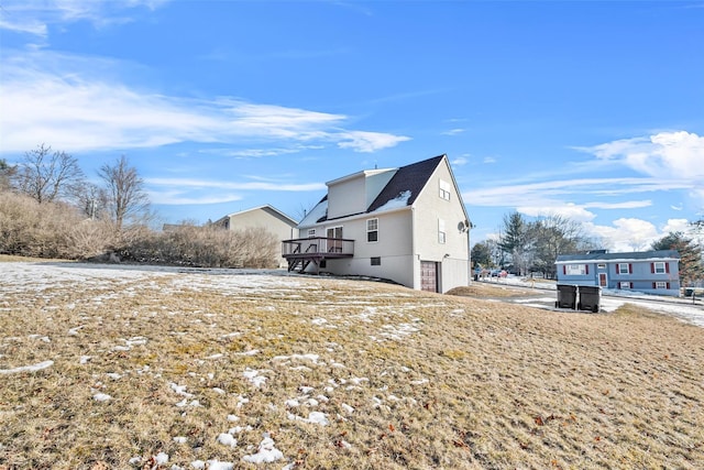 view of side of property with a wooden deck