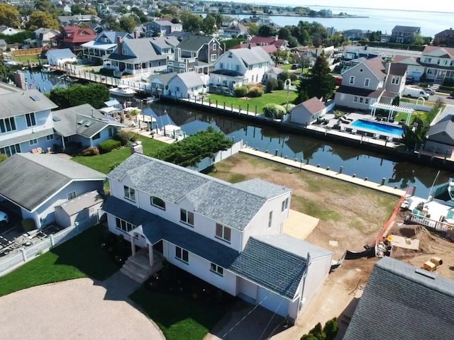 drone / aerial view with a water view