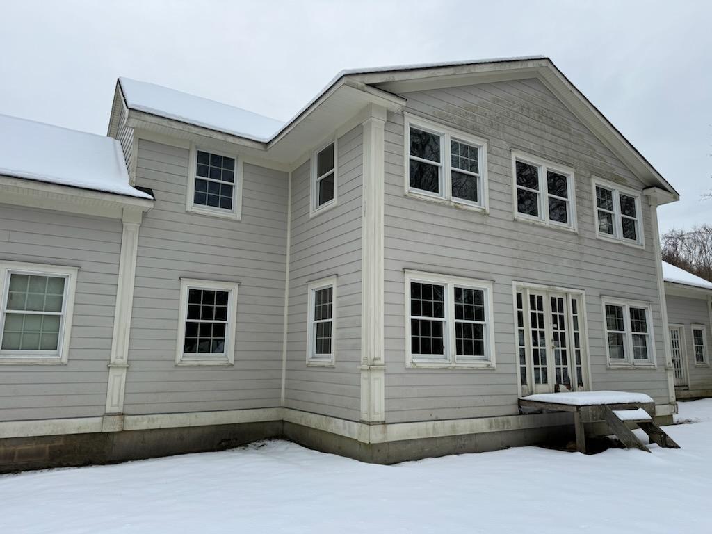 view of snow covered property