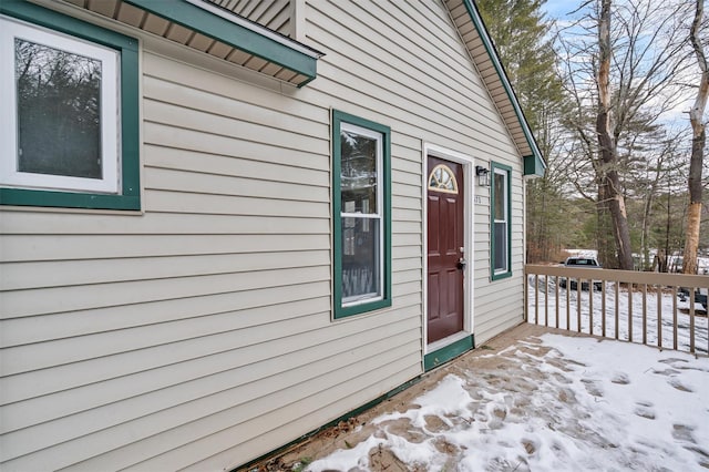 view of snow covered property entrance