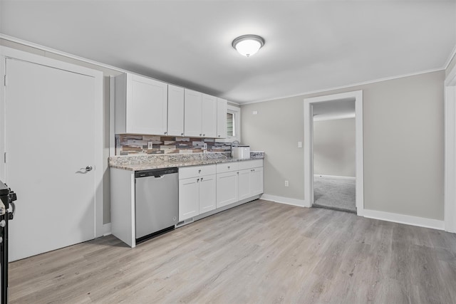 kitchen featuring light stone counters, stainless steel dishwasher, light hardwood / wood-style flooring, and white cabinets