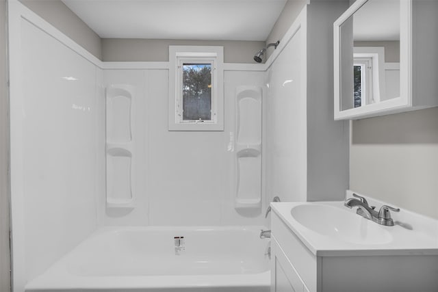 bathroom featuring vanity and washtub / shower combination