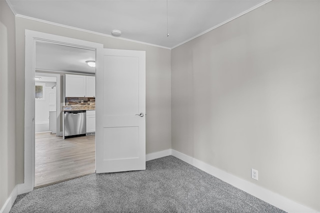 unfurnished room featuring crown molding