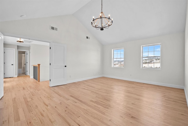 unfurnished room with a chandelier, high vaulted ceiling, light wood-style flooring, visible vents, and baseboards