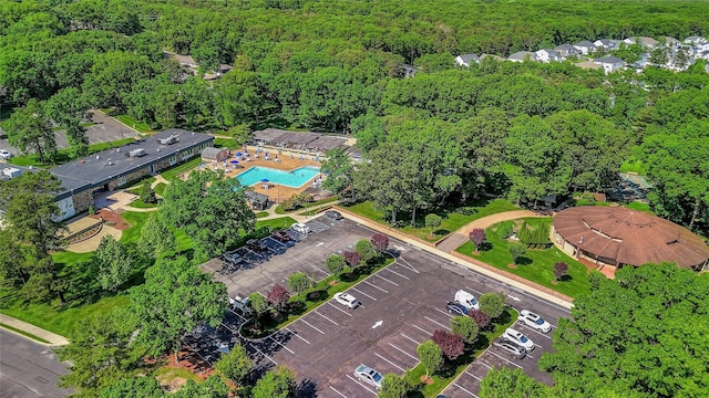 aerial view featuring a wooded view