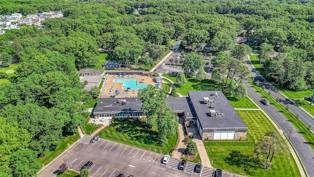 birds eye view of property with a forest view