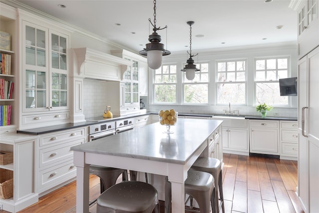 500 Hardscrabble Rd, Briarcliff Manor, NY 10510 - kitchen with light wood-type flooring, backsplash, open shelves, and white cabinetry