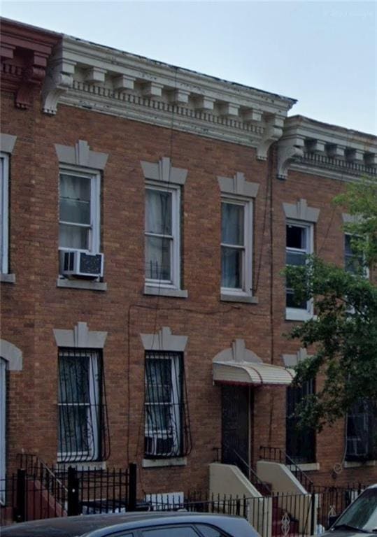 view of building exterior with cooling unit