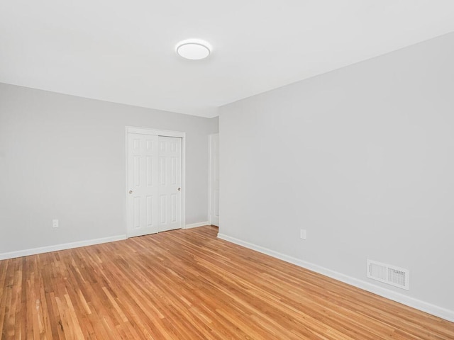 spare room featuring light hardwood / wood-style flooring