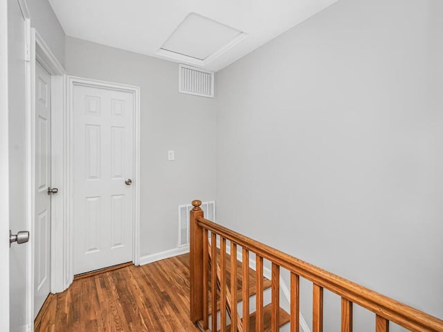 corridor with dark hardwood / wood-style floors