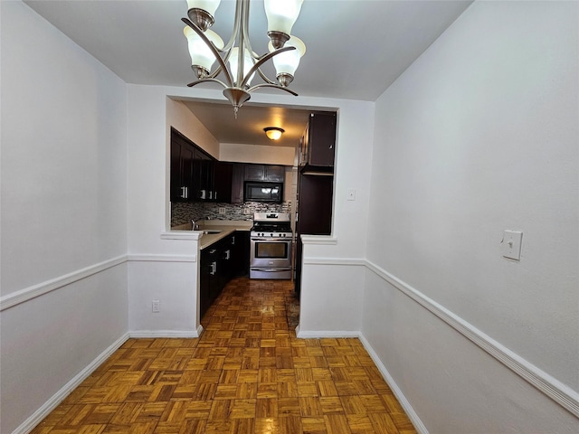 kitchen with tasteful backsplash, black microwave, sink, dark parquet flooring, and stainless steel range oven