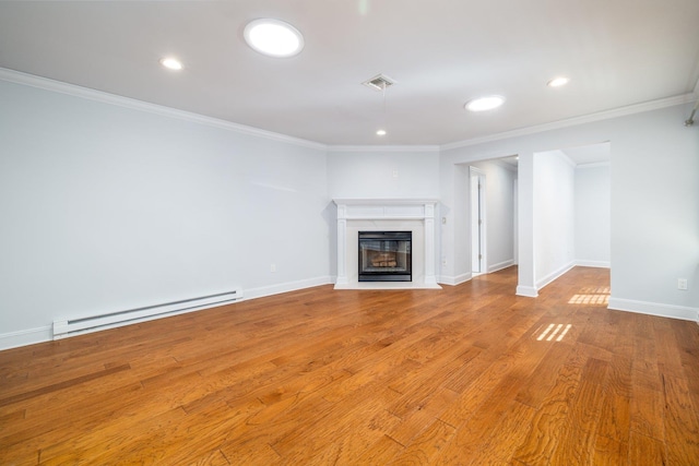 unfurnished living room featuring a baseboard radiator, ornamental molding, and light wood-type flooring