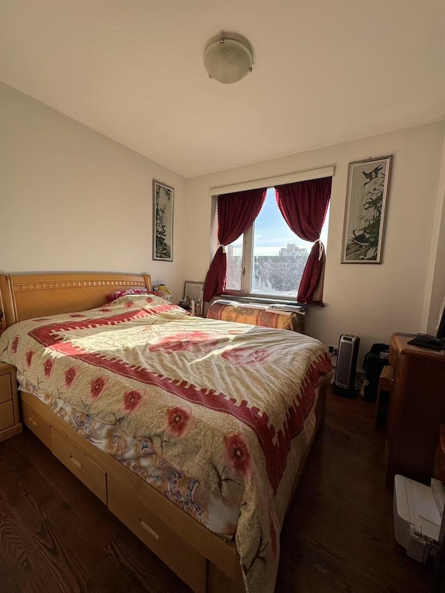 bedroom featuring dark hardwood / wood-style flooring