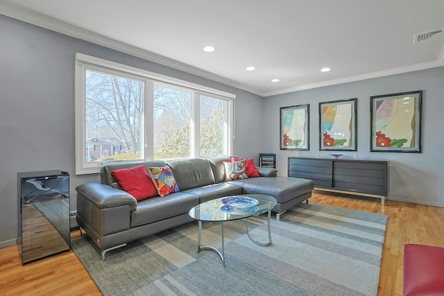 living room with recessed lighting, wood finished floors, visible vents, baseboards, and crown molding