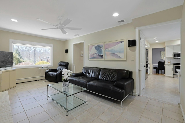 living area featuring a baseboard heating unit, visible vents, and light tile patterned flooring