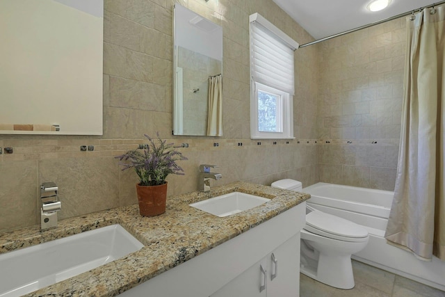 full bathroom with toilet, tasteful backsplash, tile walls, and a sink