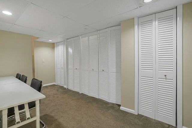 carpeted office featuring recessed lighting, a drop ceiling, and baseboards