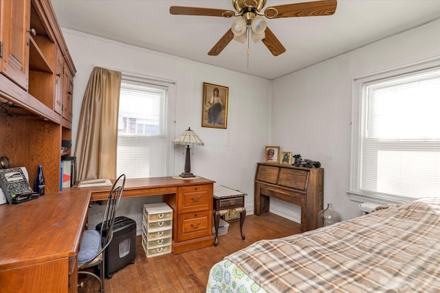 bedroom with ceiling fan and light wood-type flooring