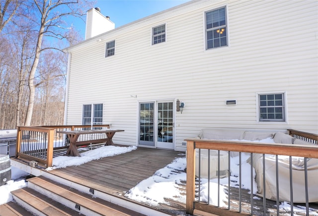 view of snow covered deck