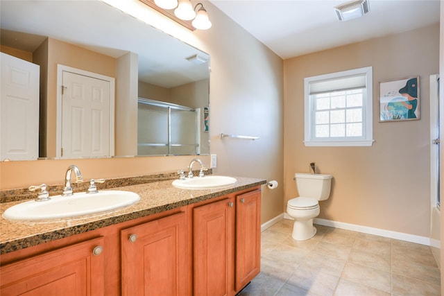 full bathroom with visible vents, a sink, and a shower with shower door