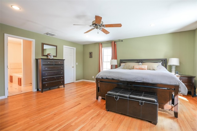 bedroom featuring light wood-style floors, visible vents, ceiling fan, and baseboards