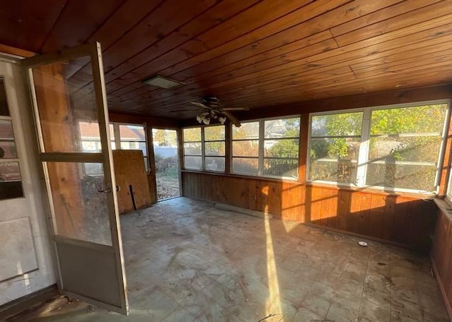 unfurnished sunroom featuring wood ceiling