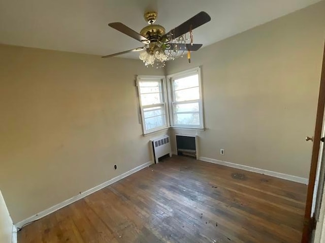 55 S Brookside Ave, Freeport, NY 11520 - unfurnished bedroom with ceiling fan, radiator, and dark hardwood / wood-style floors