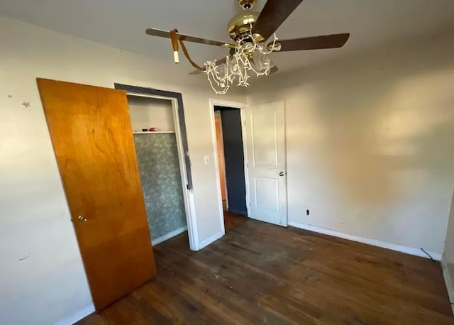 55 S Brookside Ave, Freeport, NY 11520 - unfurnished bedroom featuring dark wood-type flooring