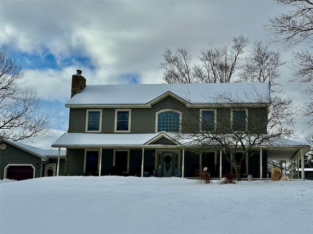 view of front of house featuring covered porch and a garage