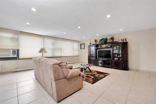 living room with cooling unit, light tile patterned floors, and a baseboard heating unit