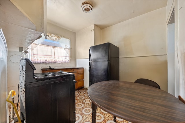 kitchen with black appliances and brown cabinetry