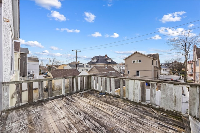 wooden deck featuring a residential view