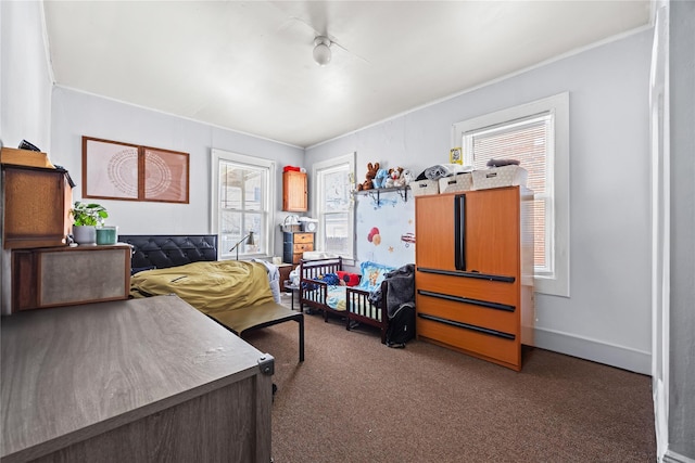bedroom featuring carpet flooring and baseboards