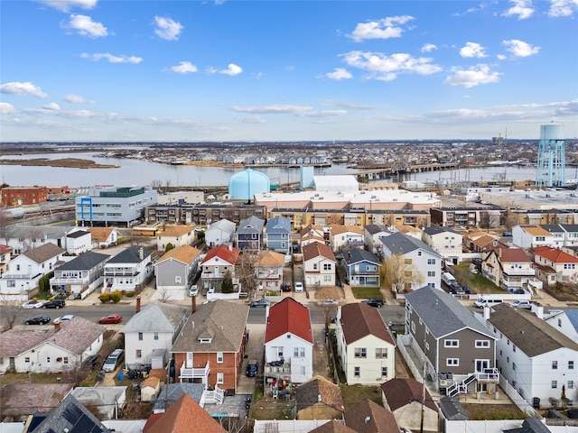 bird's eye view with a residential view and a water view
